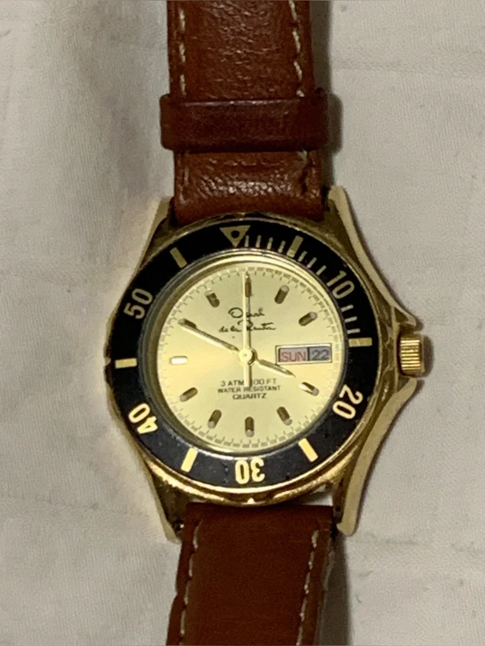 Vintage Oscar de la Renta Gold-Tone Watch with Black Bezel and Leather Strap
